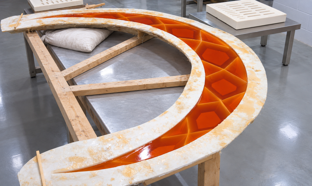 Custom amber transparent resin crescent in production mold